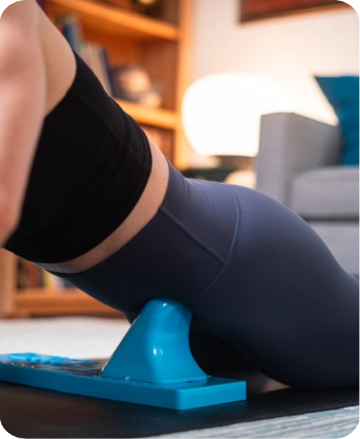 Woman releasing hip flexors after a marathon