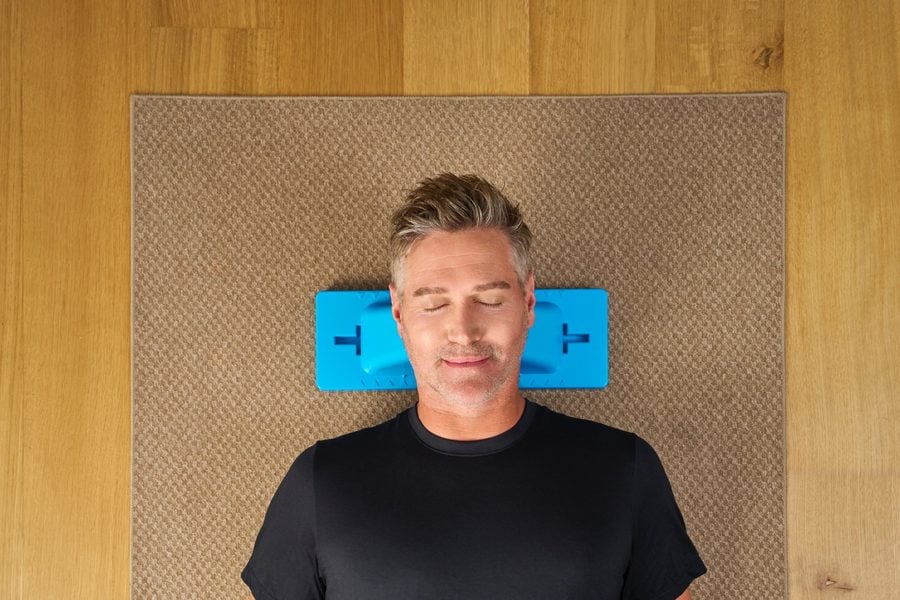 Man lying on Thrival board, at rest